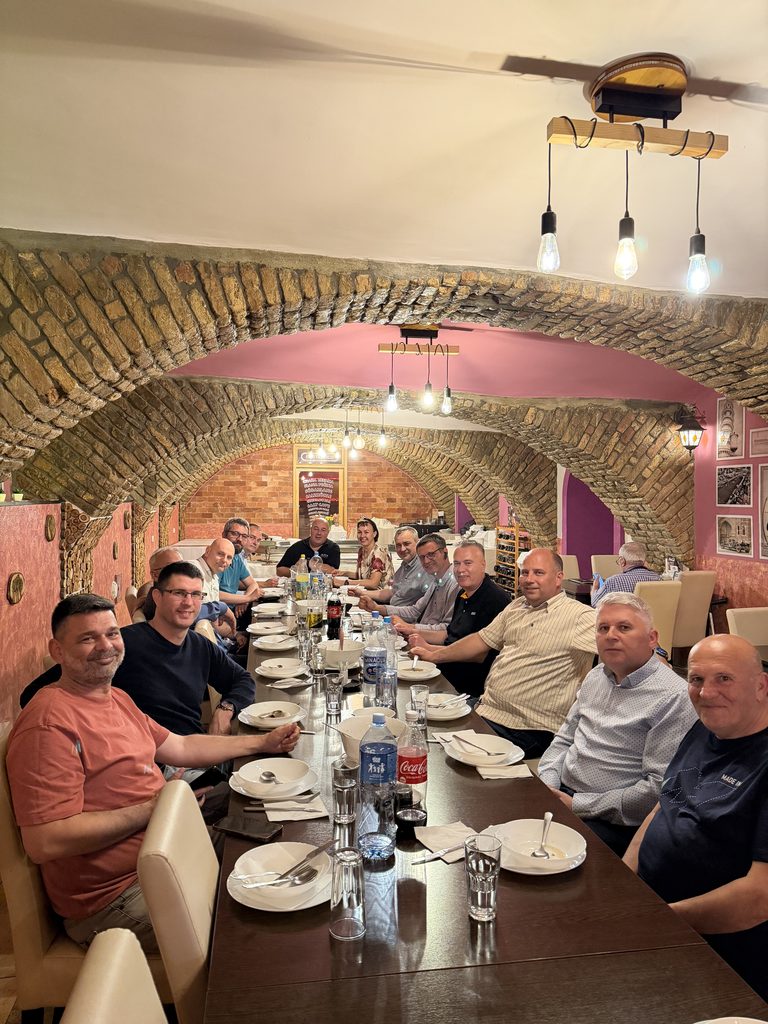Talking over lunch after the workshop, one long table